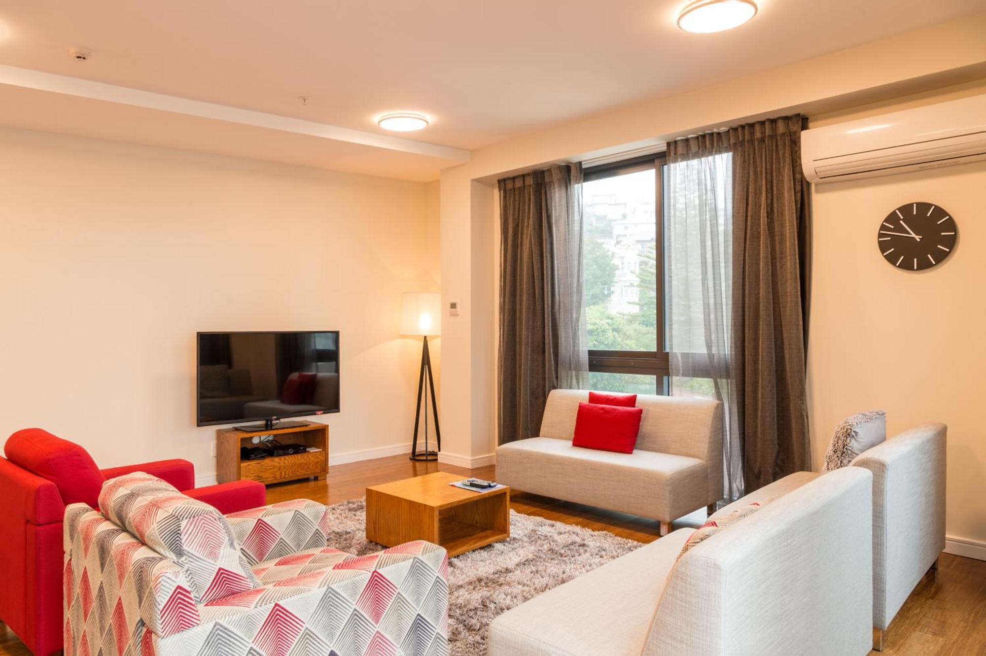 Boulcott Suites Wellington Luaran gambar A living room in a serviced apartment in Singapore
